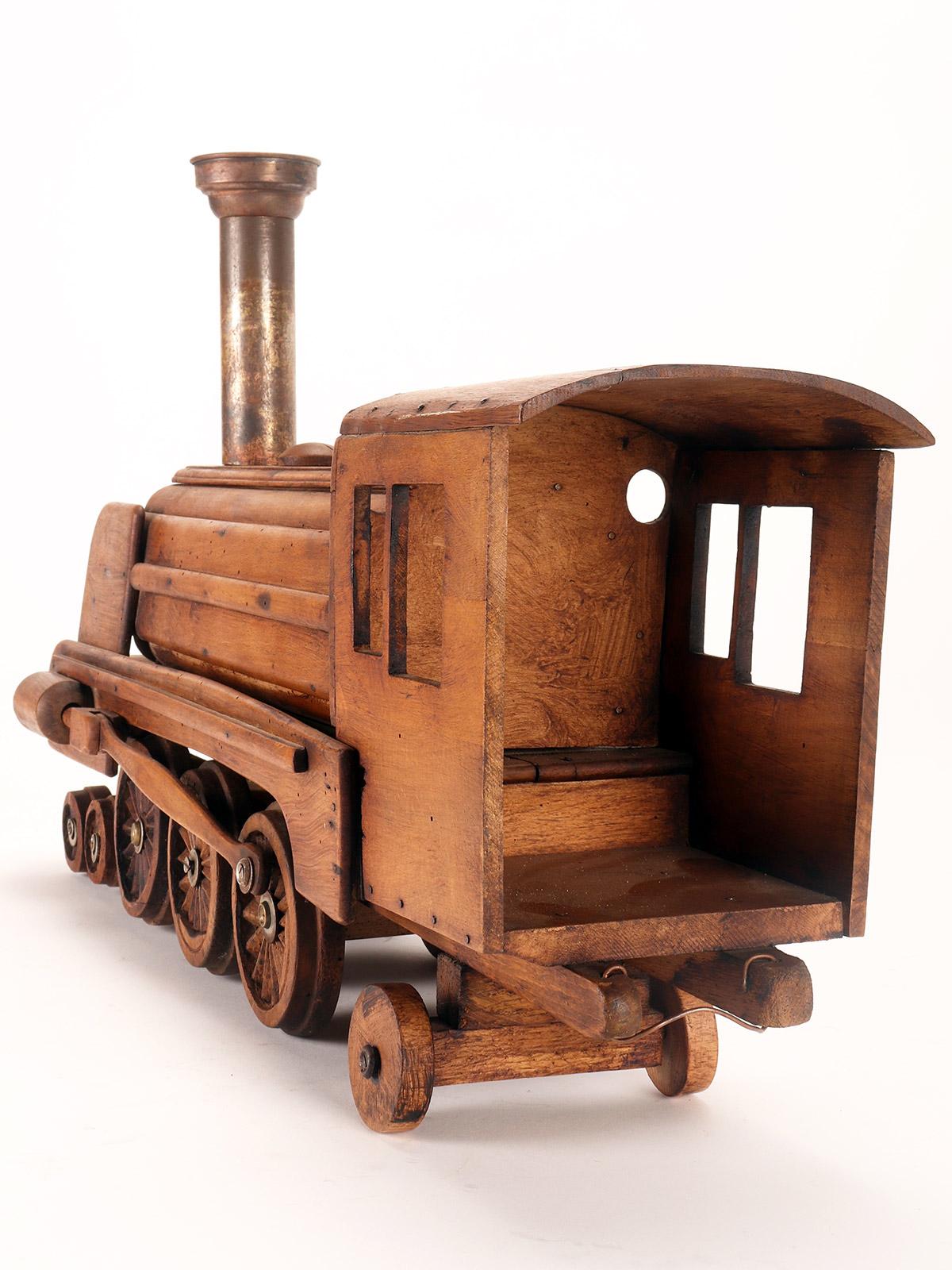 Ein Volkskunstmodell eines Spielzeugs, das eine Dampfzug darstellt, USA 1900. im Angebot 11