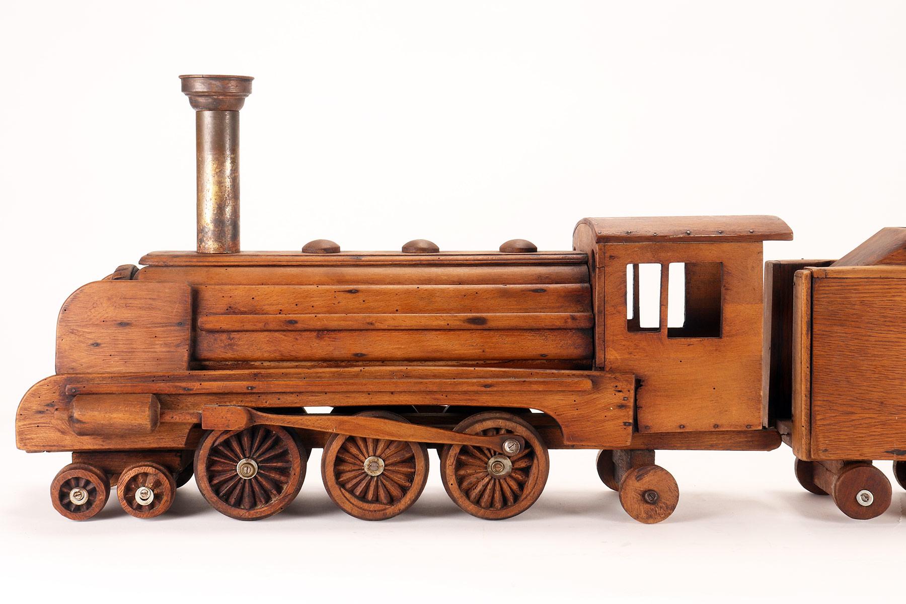 Ein Volkskunstmodell eines Spielzeugs, das eine Dampfzug darstellt, USA 1900. (amerikanisch) im Angebot