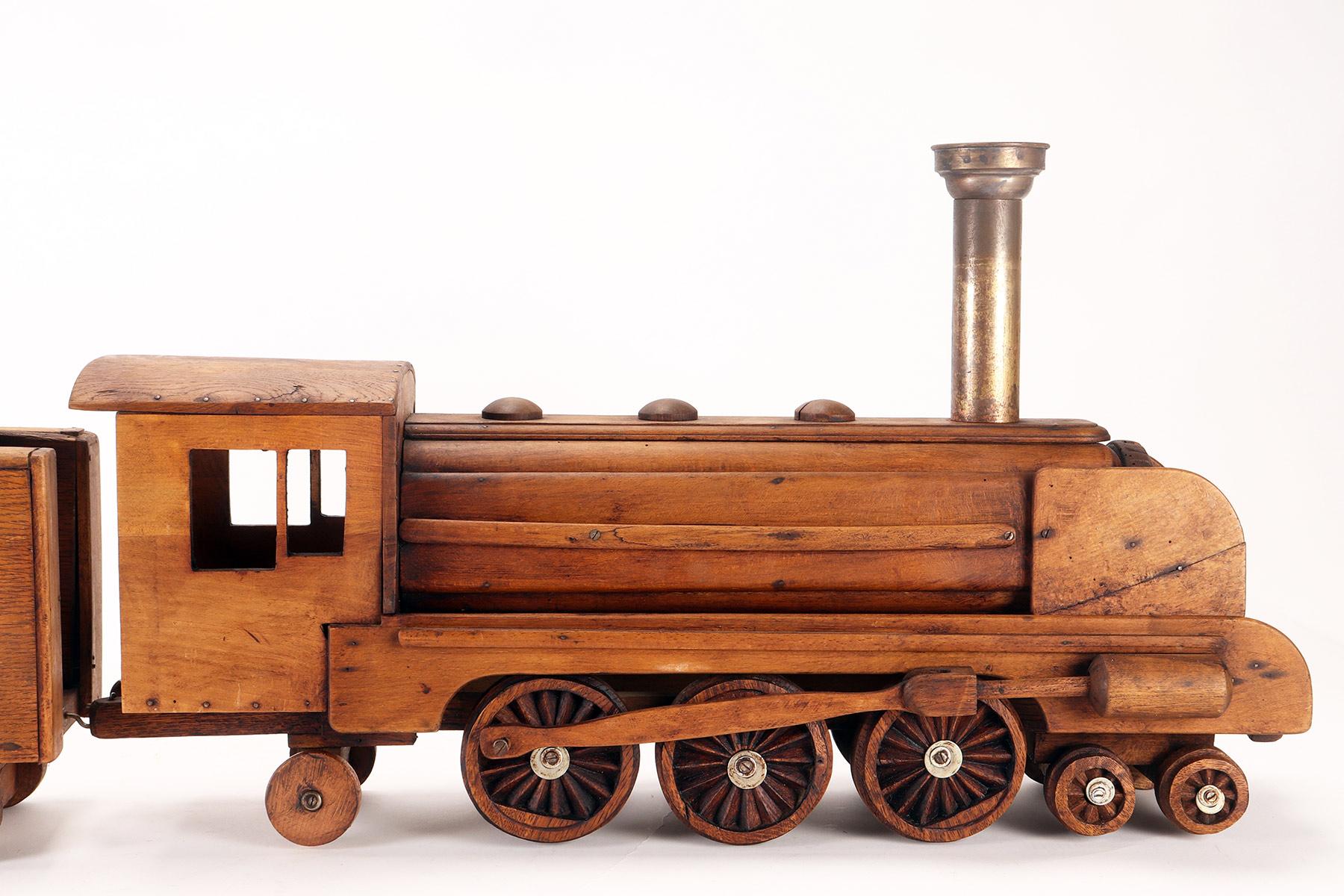 Ein Volkskunstmodell eines Spielzeugs, das eine Dampfzug darstellt, USA 1900. (Metall) im Angebot