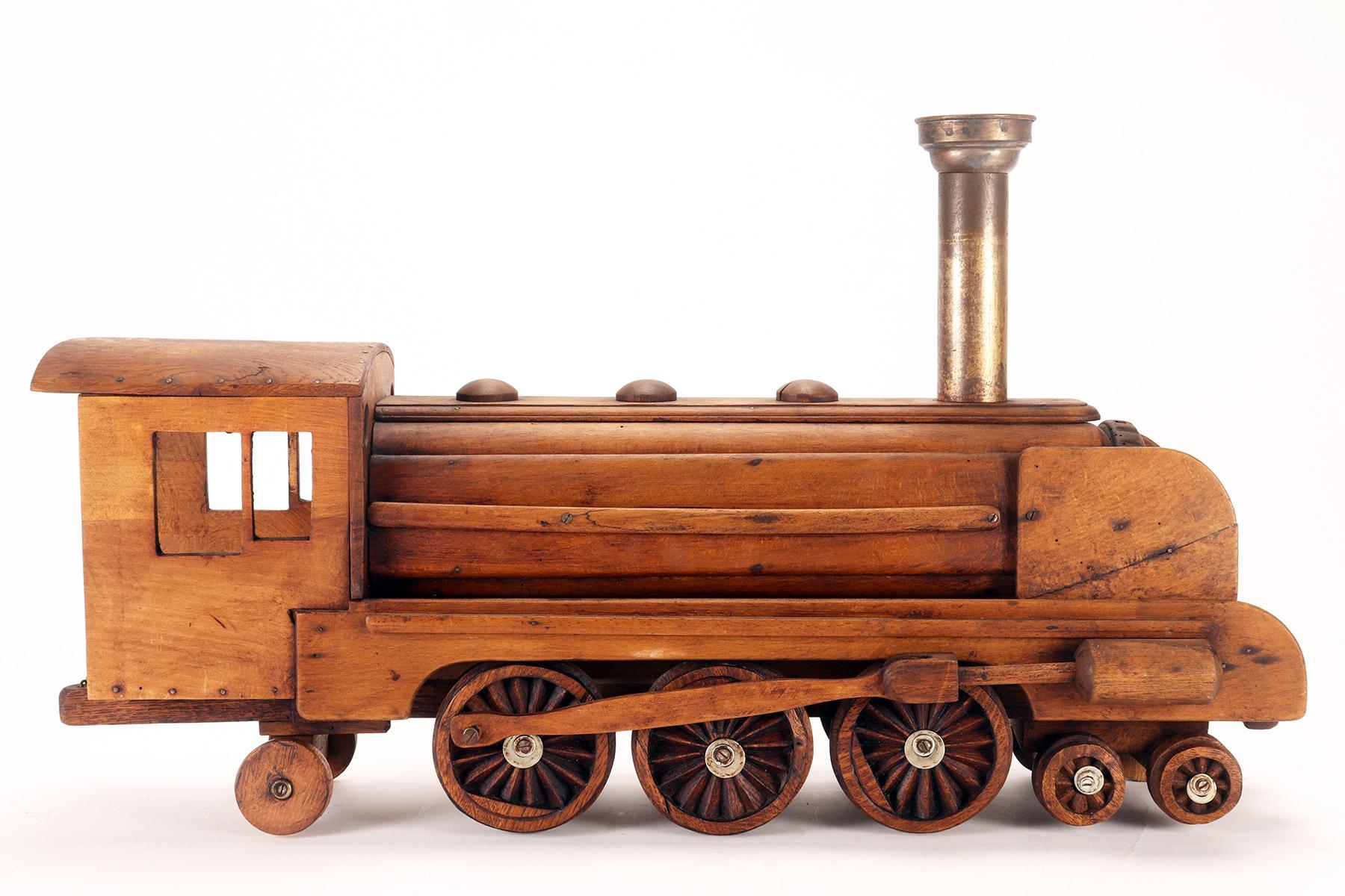Ein Volkskunstmodell eines Spielzeugs, das eine Dampfzug darstellt, USA 1900. im Angebot 2