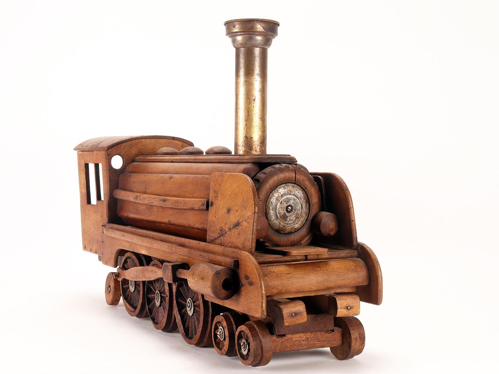 Ein Volkskunstmodell eines Spielzeugs, das eine Dampfzug darstellt, USA 1900. im Angebot 3