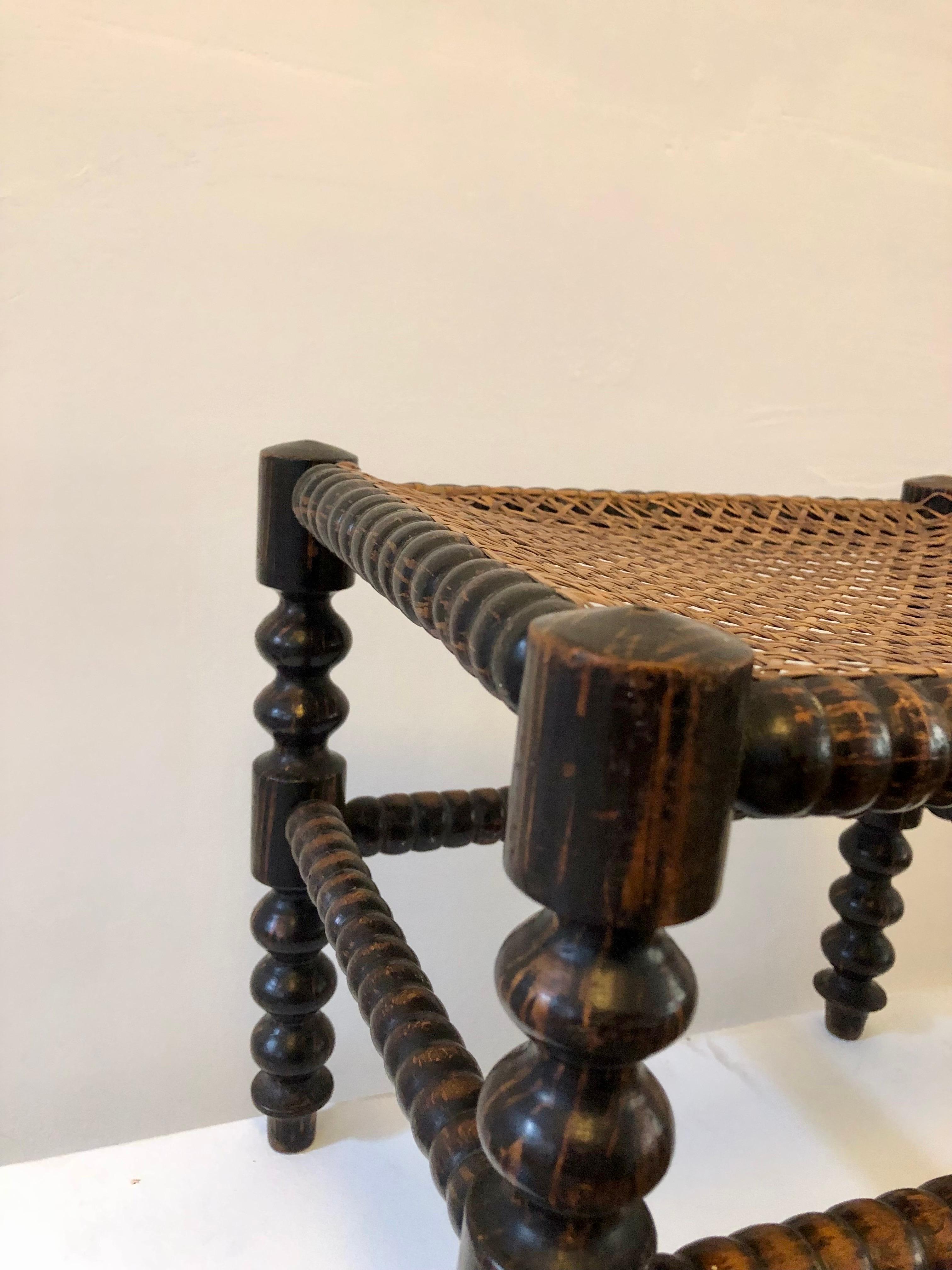 Early 20th Century A footstool from the early 20th century - turned wood and caning - France. For Sale