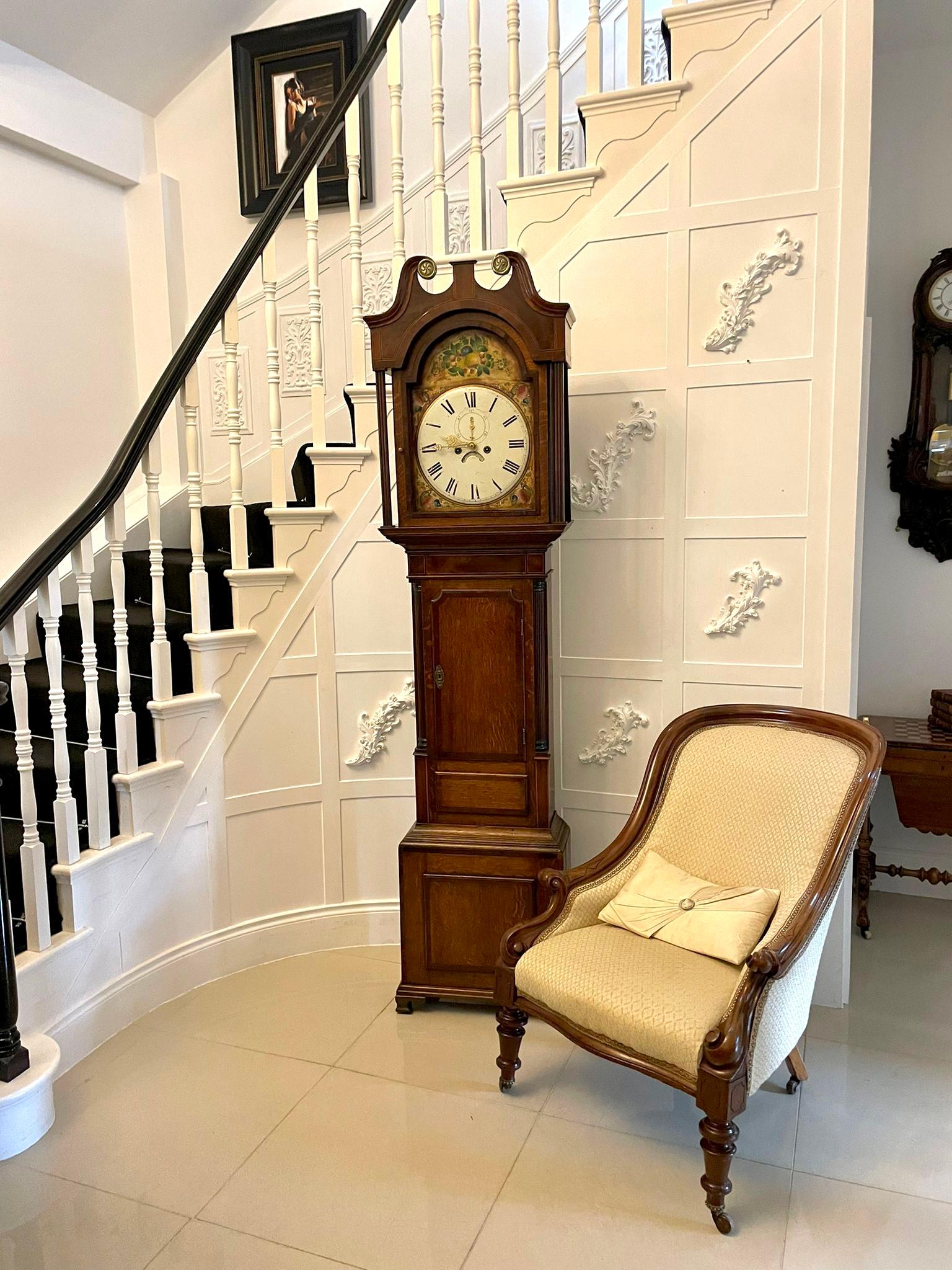 Antique George III quality oak and mahogany 8 day painted face longcase clock having a quality oak case crossbanded in mahogany with a swan neck pediment, reeded columns, shaped door to the centre flanked by reeded columns standing on shaped bracket