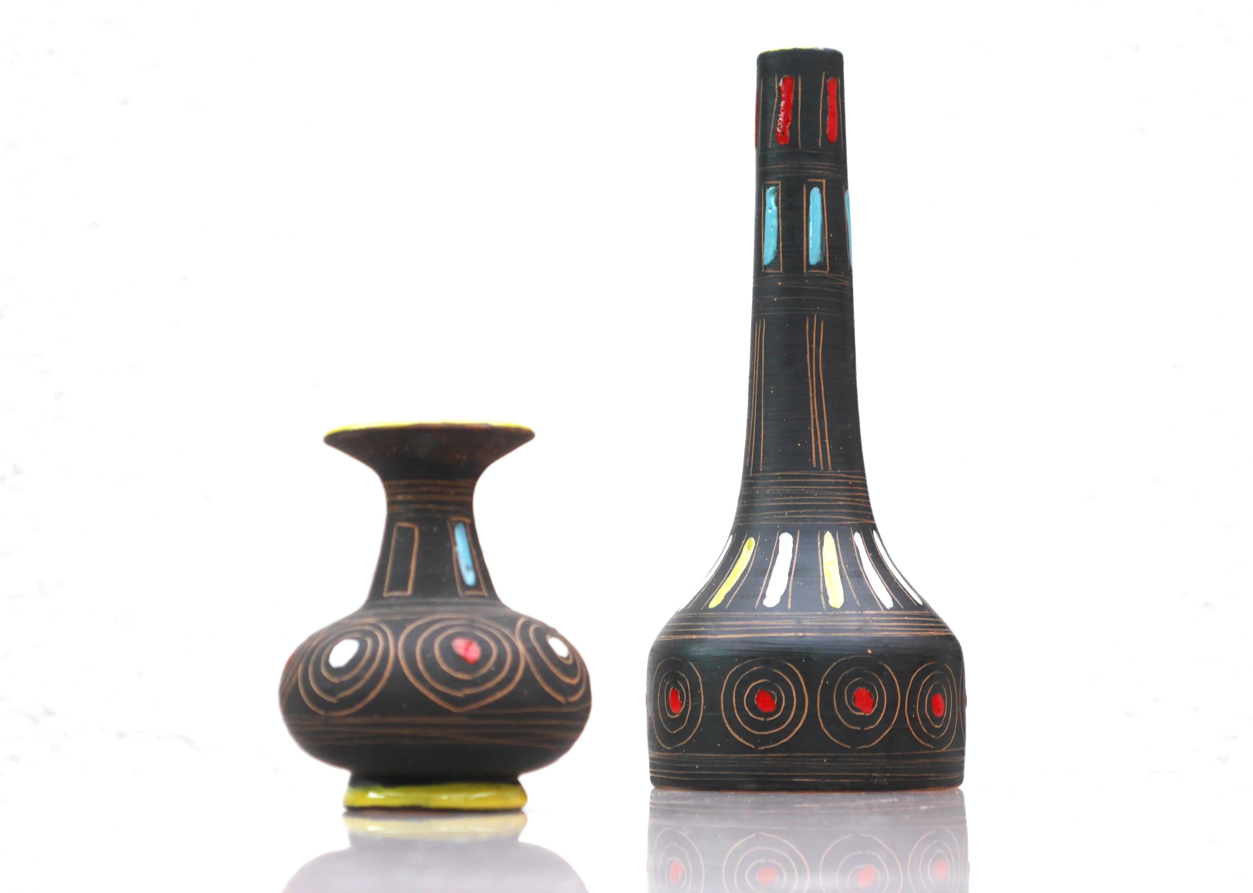 A pair of fantastic vintage ceramic vases from Fratelli Fanciullacci, Italy. These vases have a fantastic shape and decoration. The design is classic, clean lines and shapes has a similarity to Etruscan art. This gives them a rustic look combined