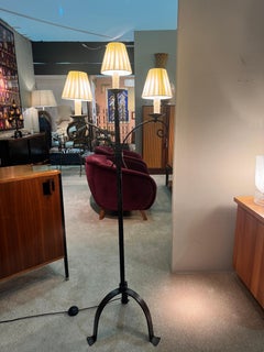 A forged wrought iron three arms floor lamp