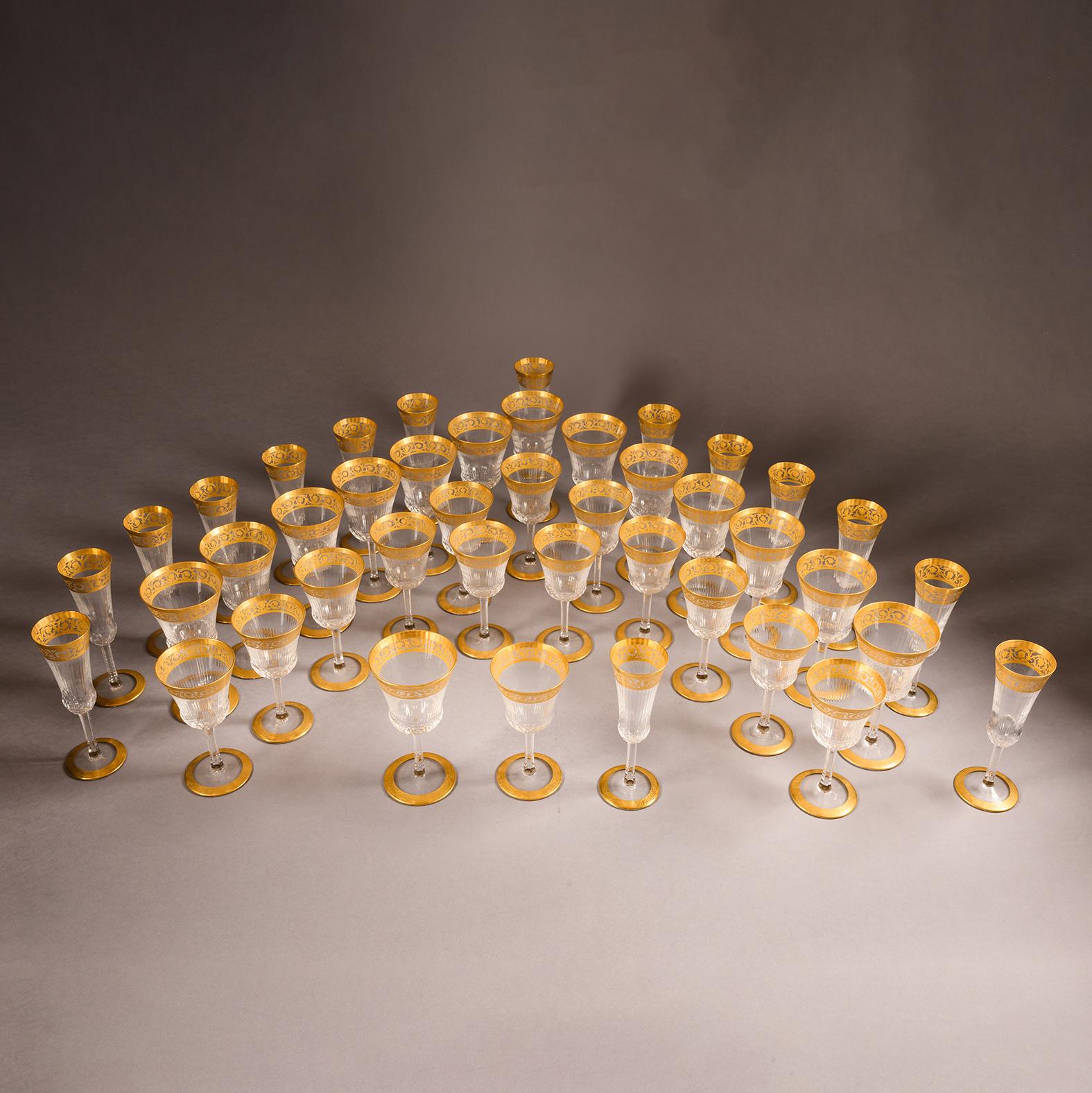 A Rare Crystal and Gilt Forty-Three Piece Table Service by La Cristallerie de Saint Louis.  This fine and luxurious service is in the famous ‘Thistle’ pattern developed by La Cristallerie de Saint Louis prior to the first world war. 

Each glass is
