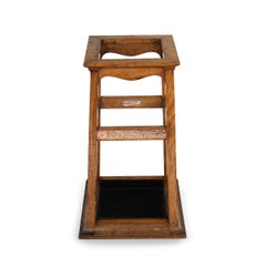 A Foudroyant oak and copper umbrella stand by Goodall, Lamb & Heighway
