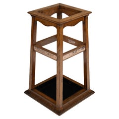 A Foudroyant oak and copper umbrella stand by Goodall, Lamb & Heighway
