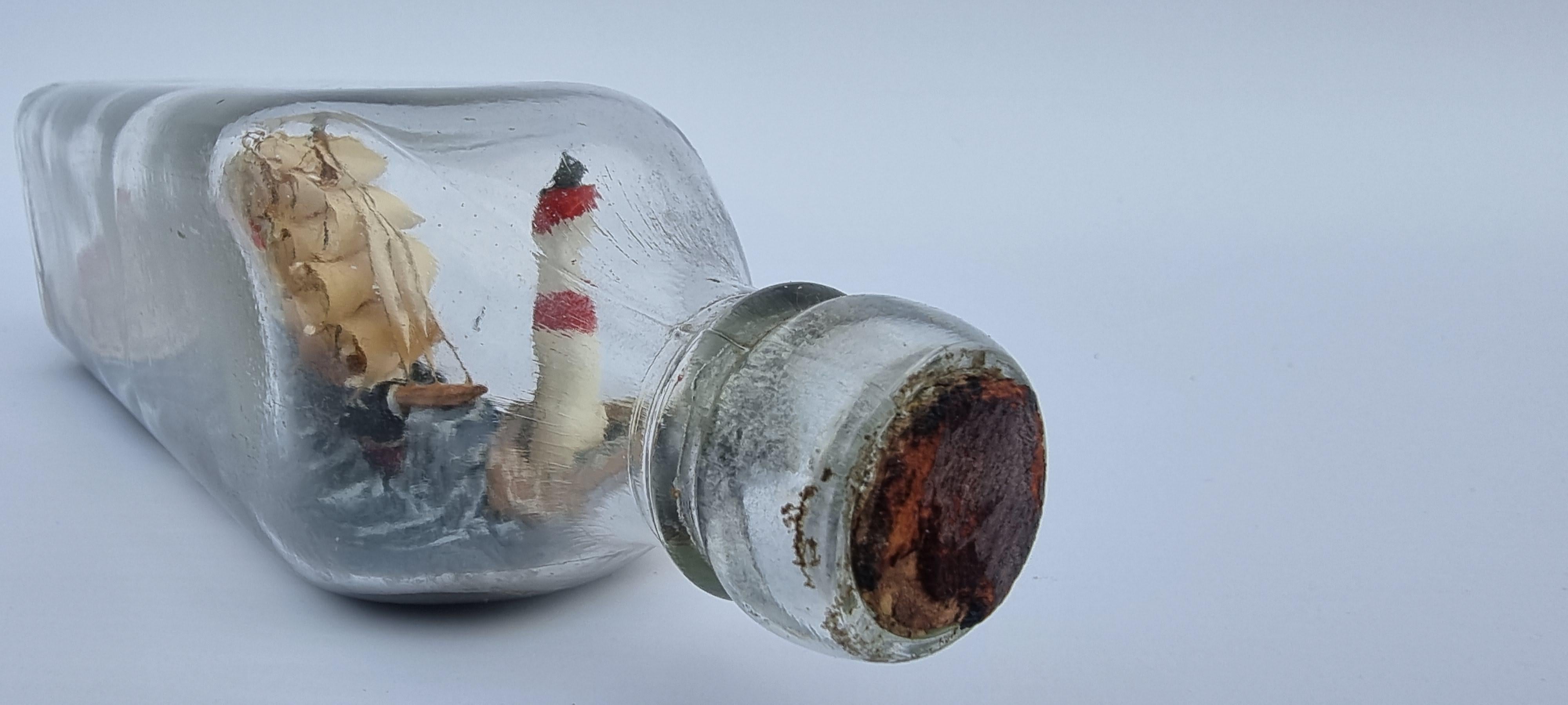 Hand-Crafted A four mast 18th century ship in a bottle, English folk art circa 1920 For Sale