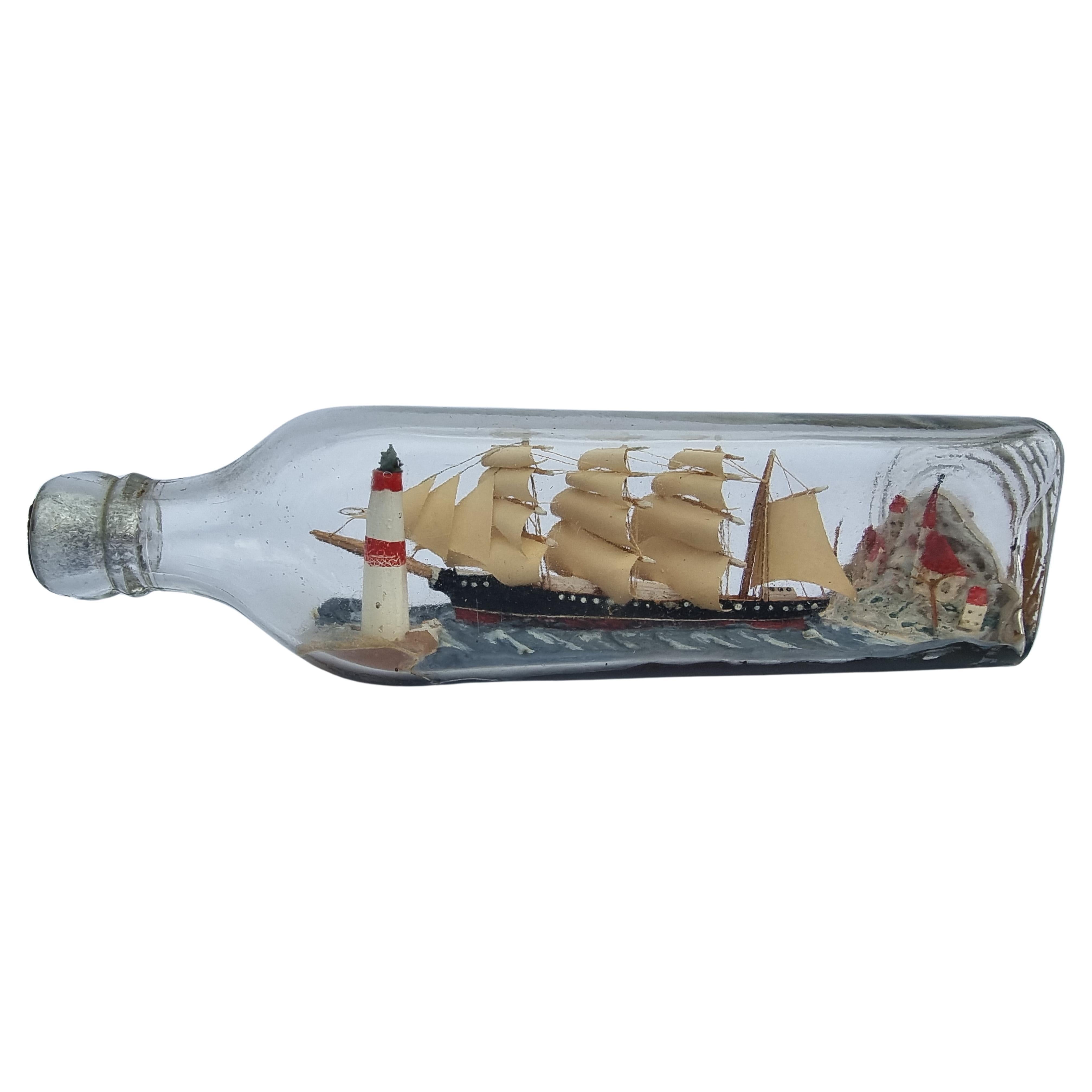 A four mast 18th century ship in a bottle, English folk art circa 1920 For Sale