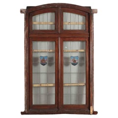 Antique A four panel mahogany window set in frame with leaded glass having ship motif.