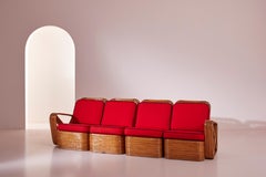 A four-seat rattan and fabric sectional sofa in the style of Paul Theodore Frank