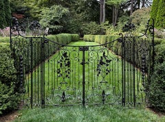A Four Section Pair of Wrought-iron Gates with Floral Embellishments