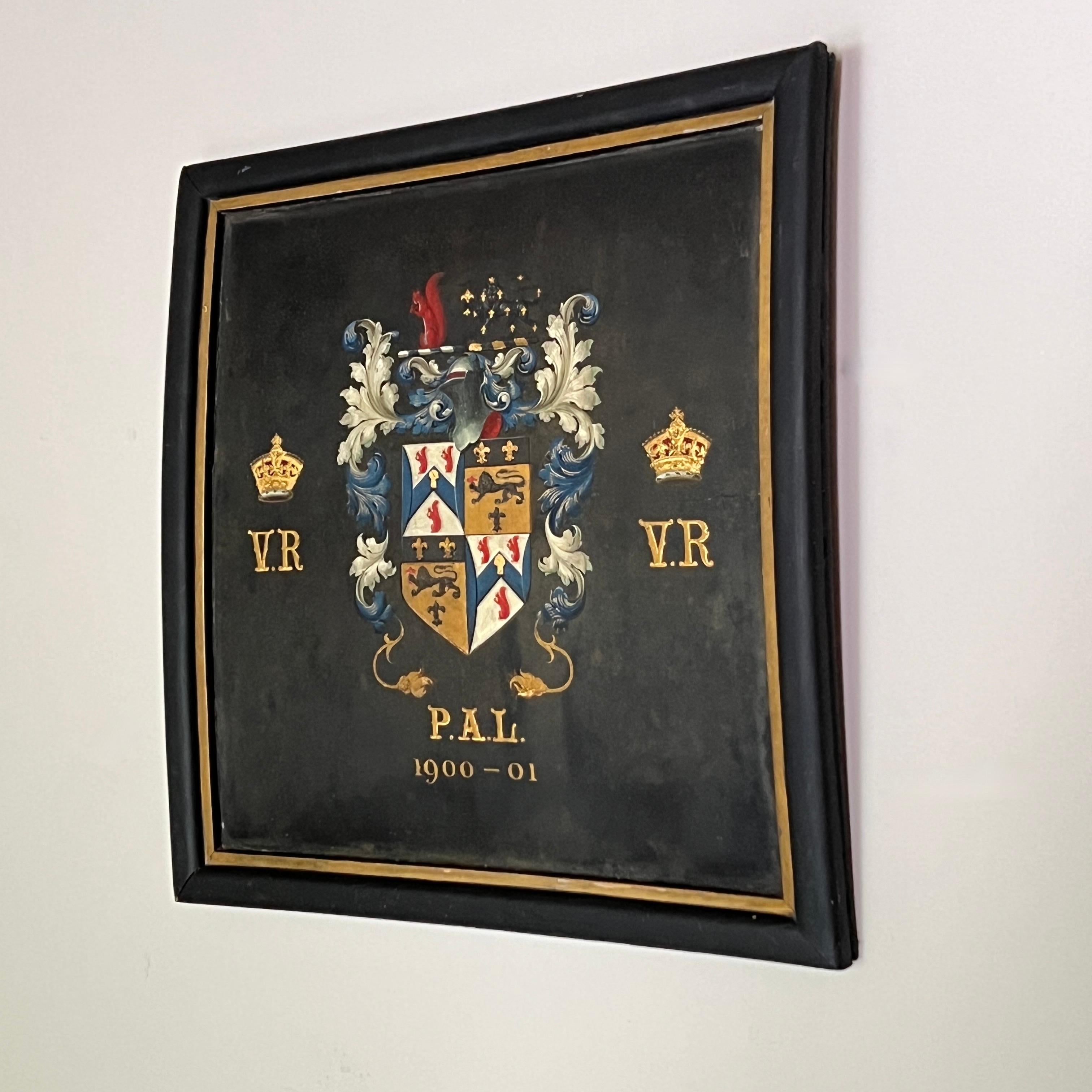 A stunning Framed Hand-Painted Coat of Arms Coach Panel from circa 1900. The piece is beautifully executed with meticulous attention to detail, showcasing the craftsmanship of a skilled artist. The panel features a gentle curve, typical of coach
