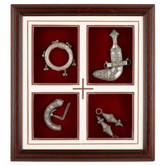 A framed Omani sterling silver and silver filigree presentation set