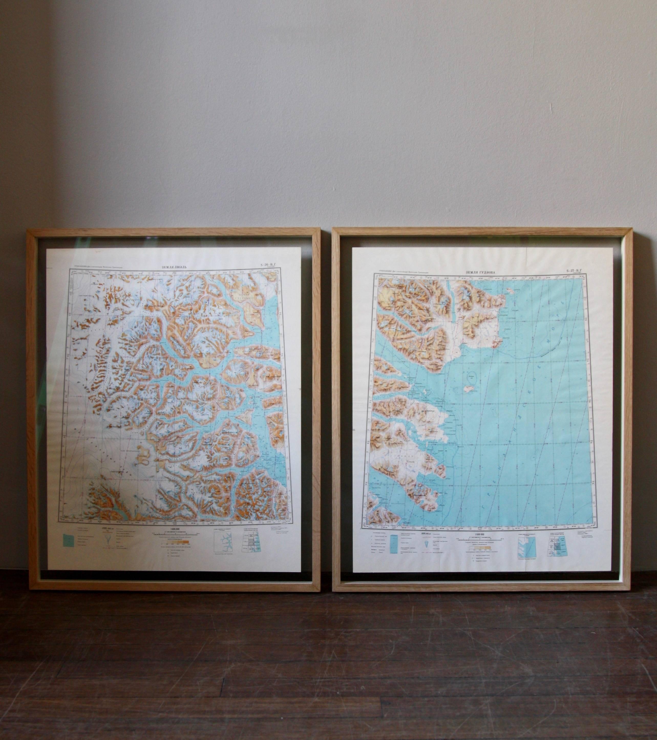 A pair of maps detailing an Eastern section of Greenland. The maps were drawn and produced by the USSR circa 1960. As well as illustrating the lay of the land, population densities are recorded too -down to the last igloo.

The colours of the maps