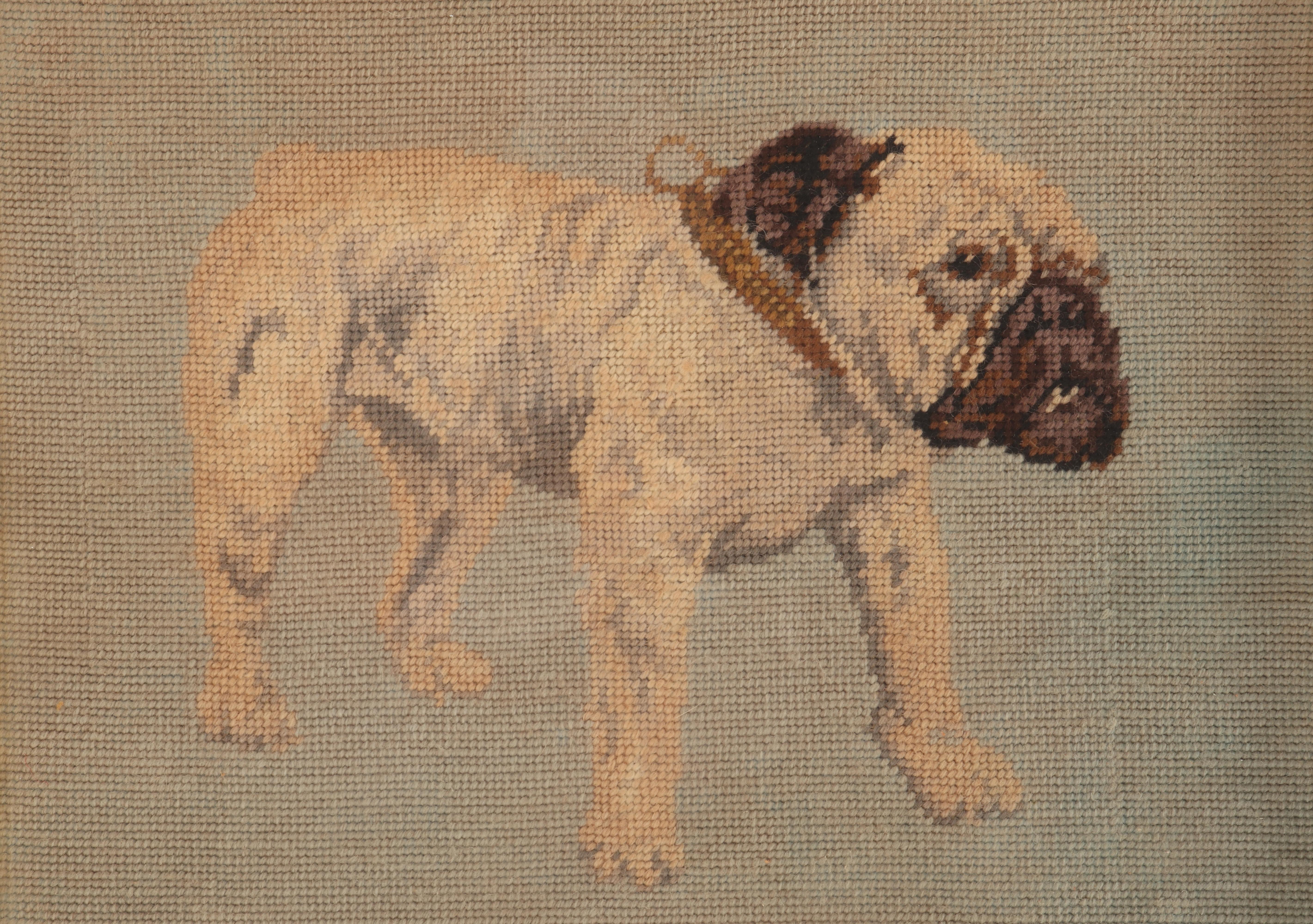 A framed small stitch embroidery (petit-point), depicting a bulldog. Golden painted wooden frame. Austria, circa 1880.