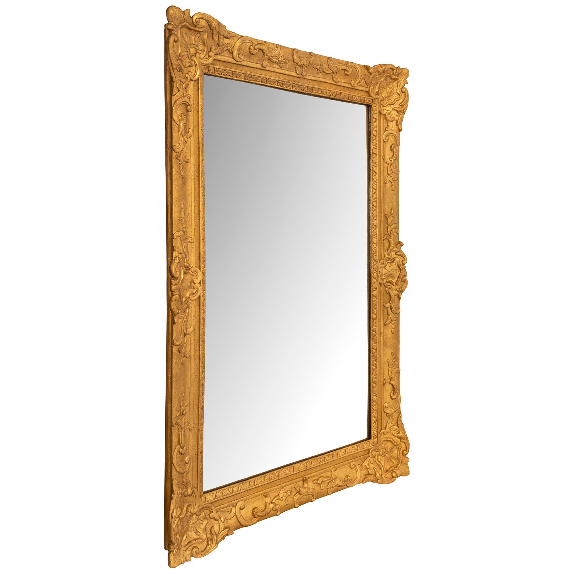 Regency A French 18th century Regence period rectangular giltwood mirror For Sale