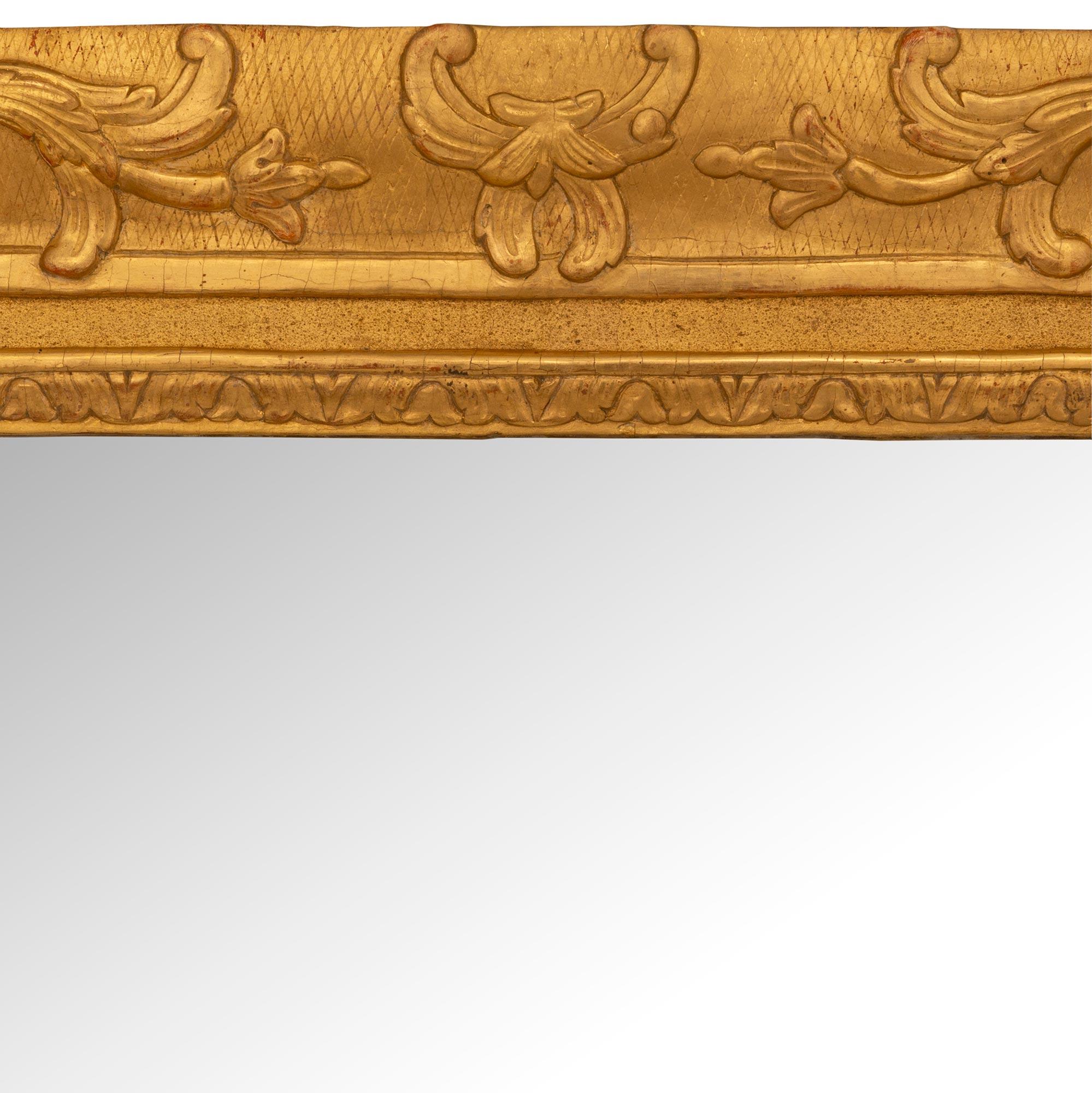 18th Century and Earlier A French 18th century Regence period rectangular giltwood mirror For Sale