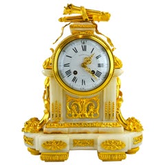 Horloge française du 19ème siècle de style Louis XVI en bronze doré et onyx par Raingo Frères