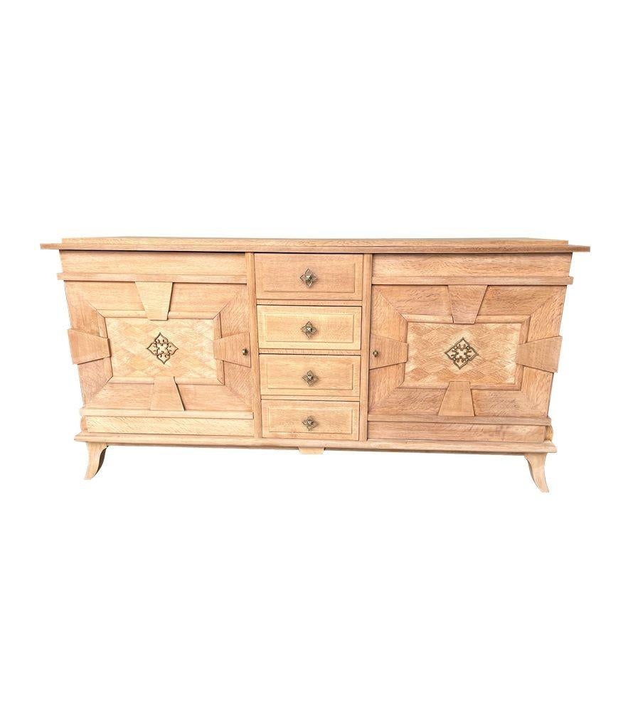 Art Deco A French 1940s bleached oak sideboard with door detail and original handles. For Sale