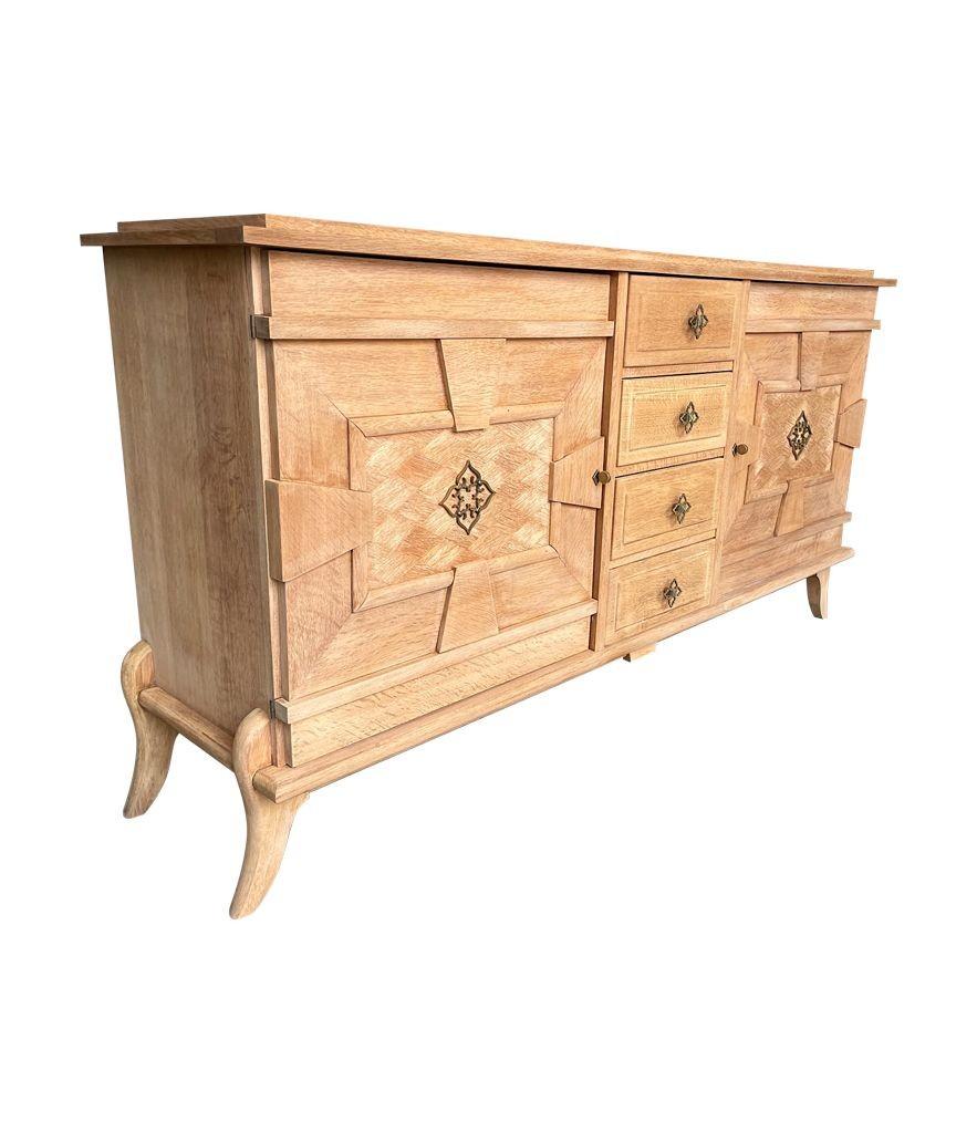 Bleached A French 1940s bleached oak sideboard with door detail and original handles. For Sale