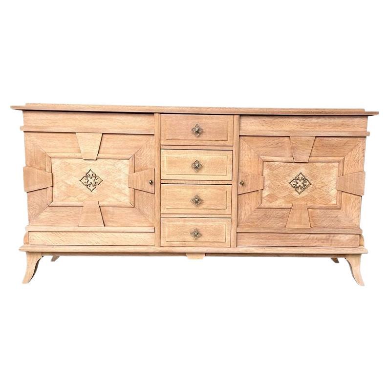 A French 1940s bleached oak sideboard with door detail and original handles.