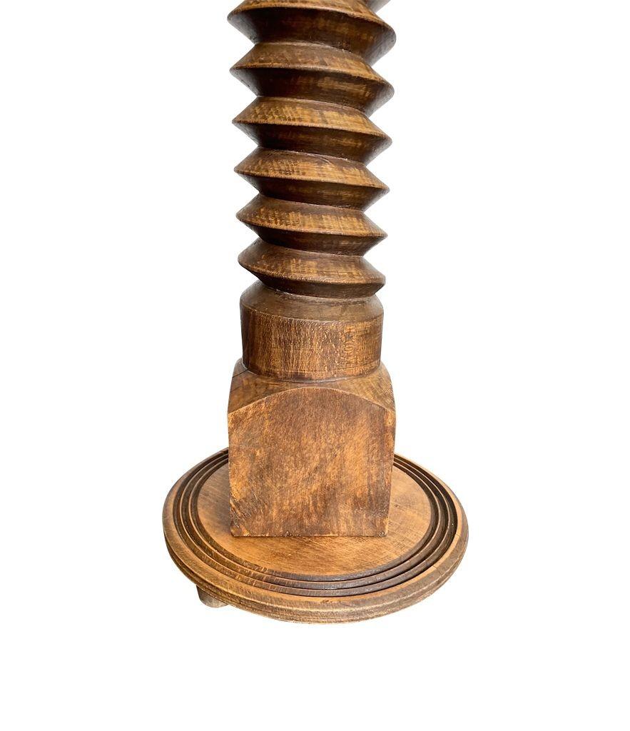 Mid-20th Century A French 1940s solid oak corkscrew floor lamp in the style of Charles Dudouyt