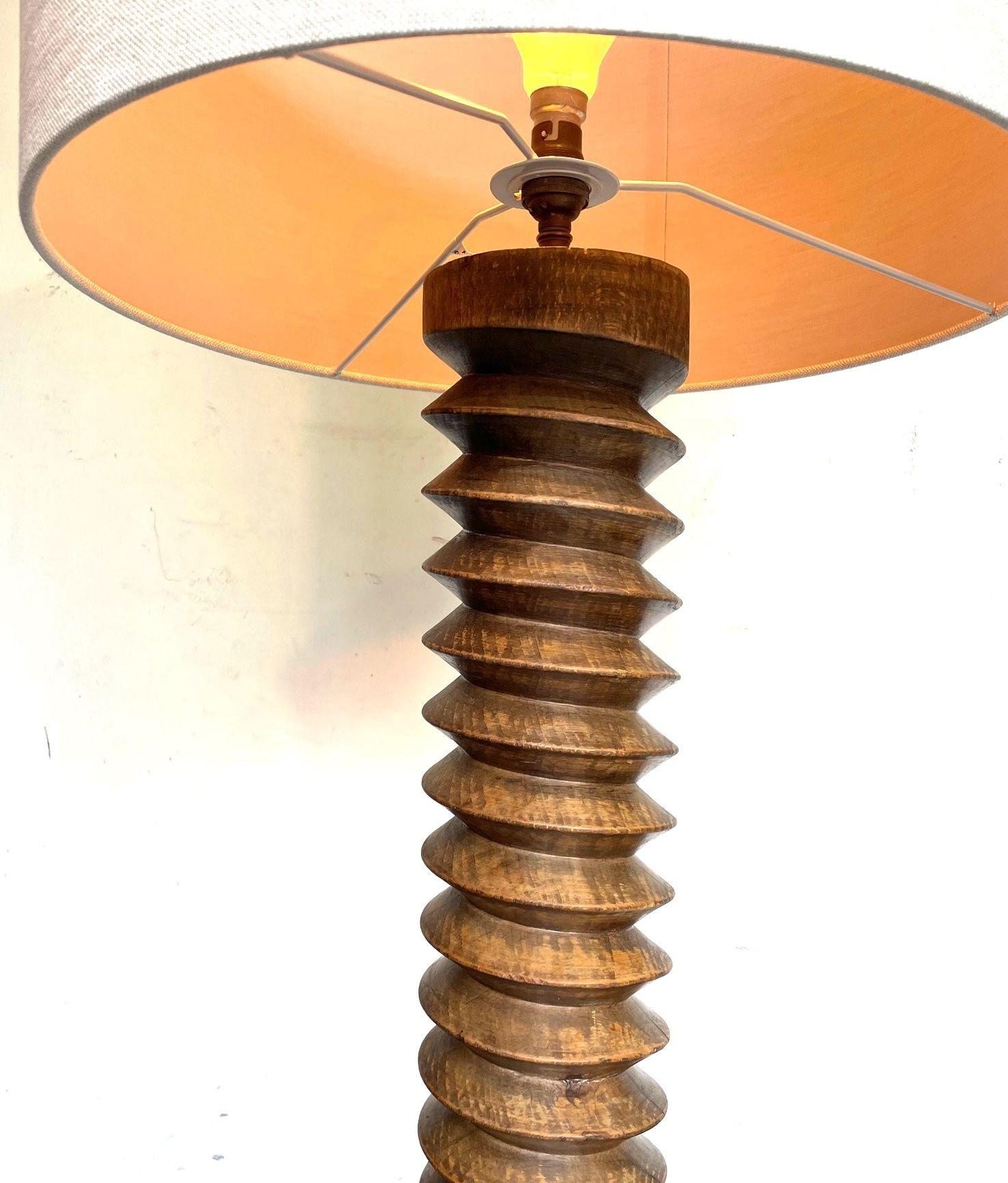 Oak A French 1940s solid oak corkscrew floor lamp in the style of Charles Dudouyt