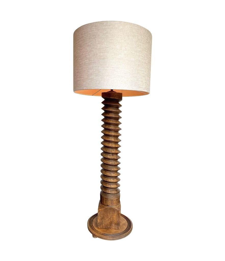 A French 1940s solid oak corkscrew floor lamp in the style of Charles Dudouyt 4