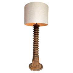 A French 1940s solid oak corkscrew floor lamp in the style of Charles Dudouyt
