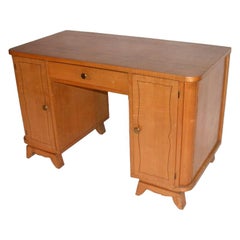 A French 1950's Sycamore Desk