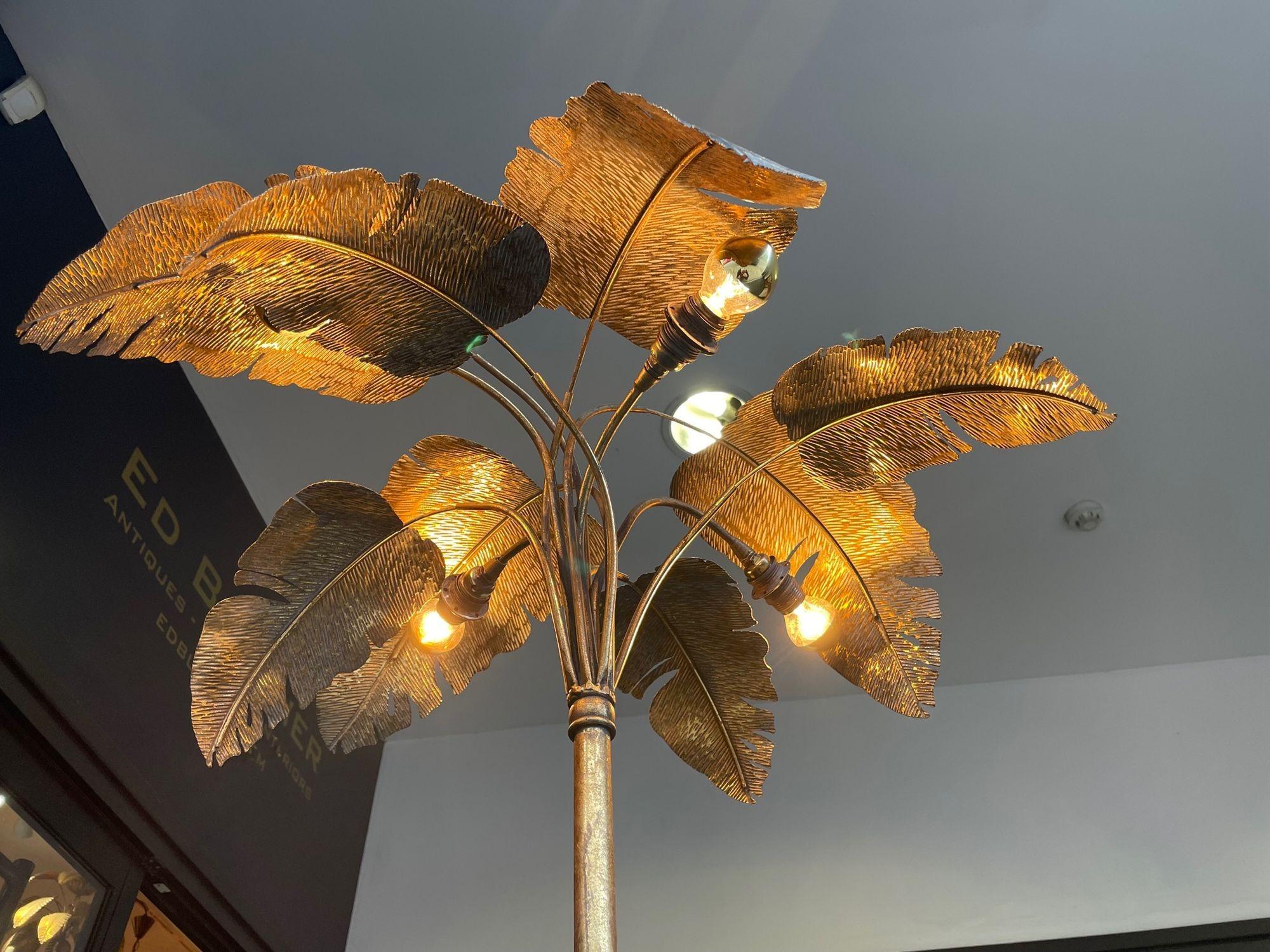 A French 1960s gilt metal palm tree floor lamp with four lights and realistic metal palm leaves. Re wired with antique cord flex, foot switch and PAT tested.