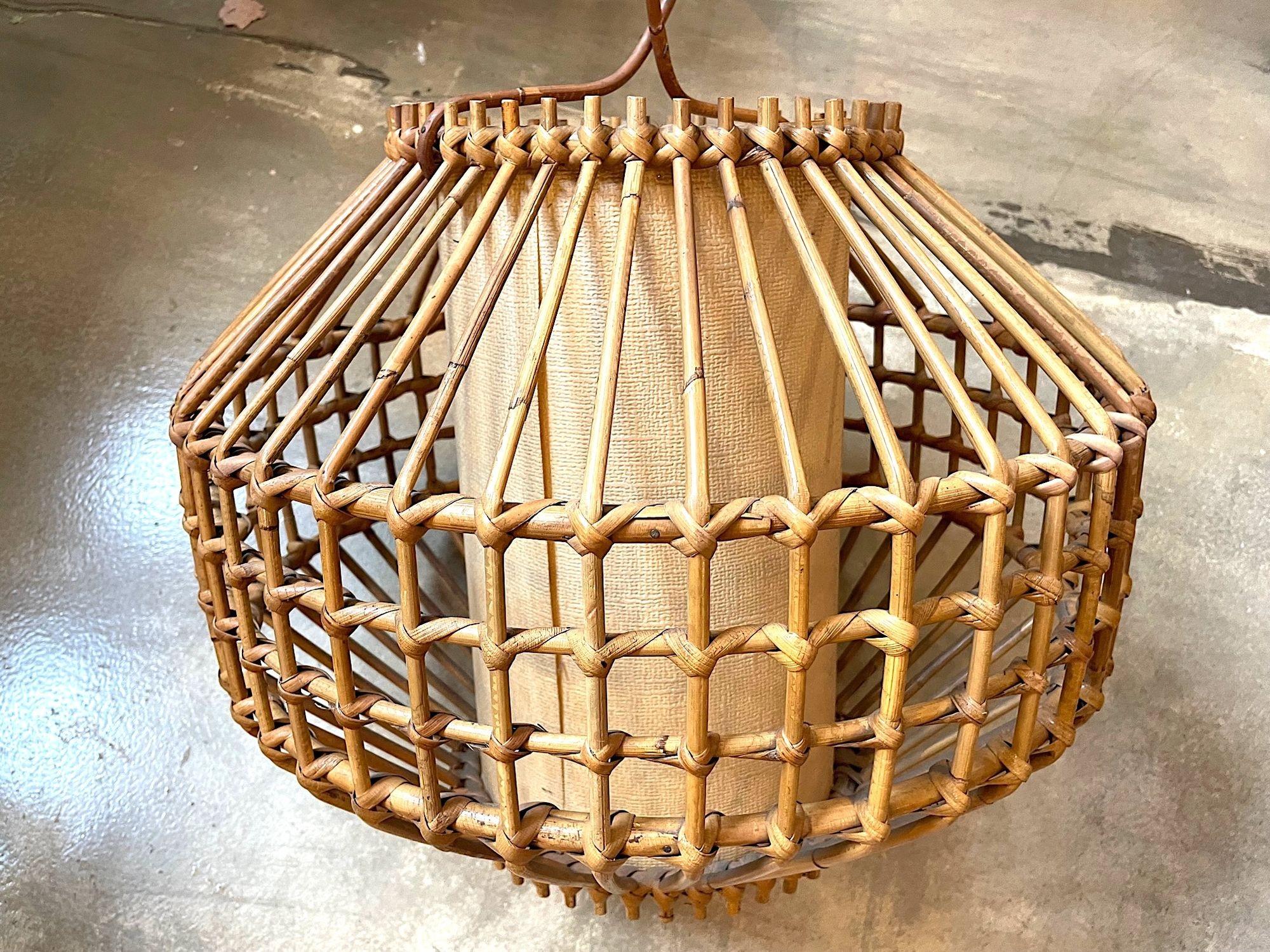 Hand-Woven A French 1960s woven bamboo and parchment hanging light by Louis Sognot For Sale
