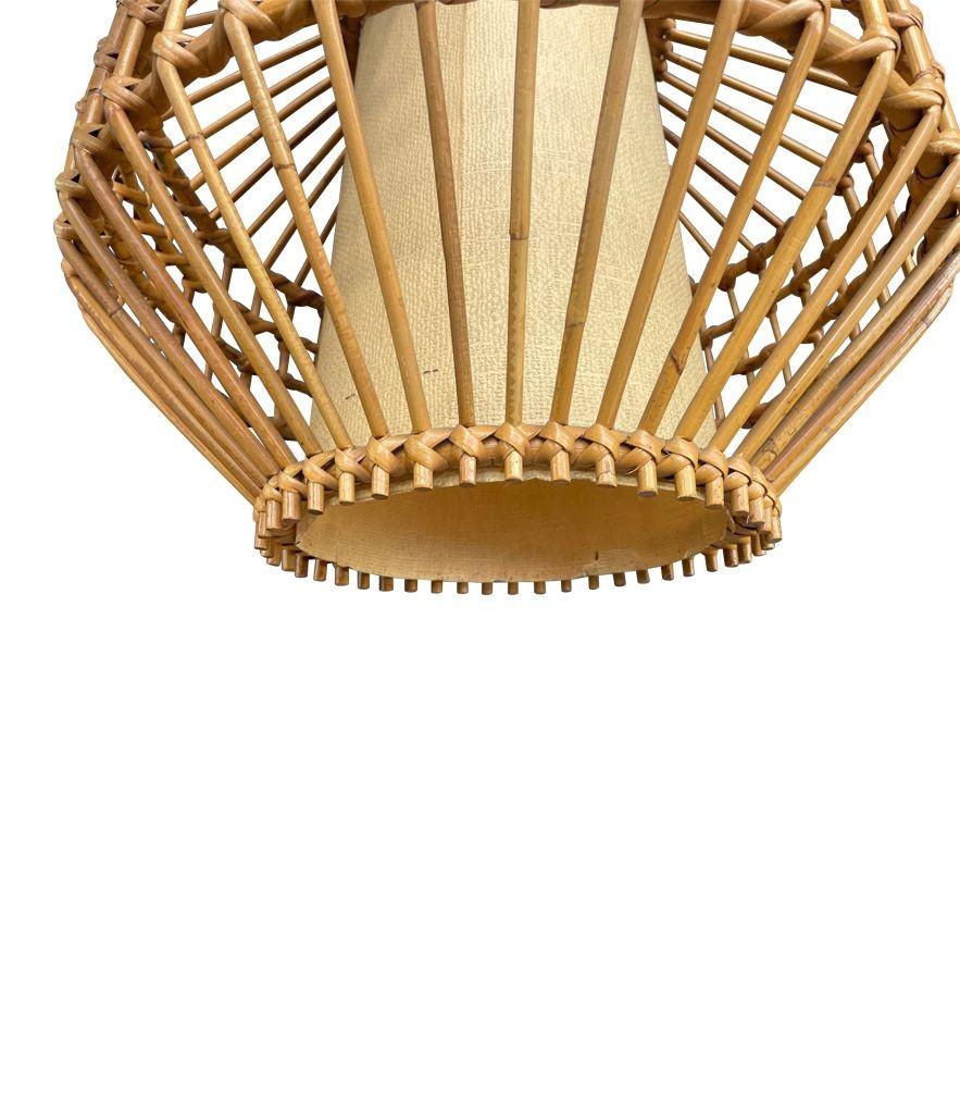 Bamboo A French 1960s woven bamboo and parchment hanging light by Louis Sognot For Sale