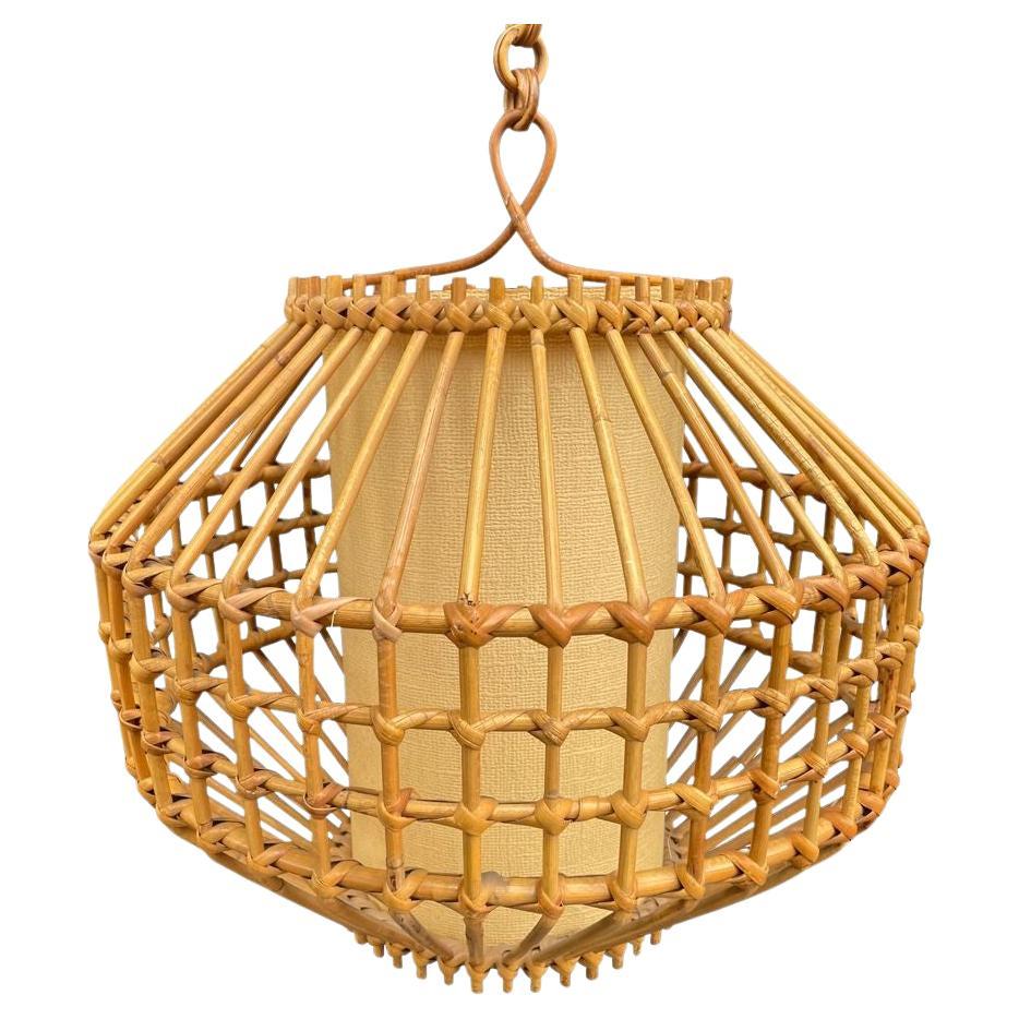 A French 1960s woven bamboo and parchment hanging light by Louis Sognot For Sale