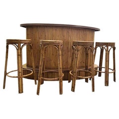 A French 1970s bamboo bar with four orignal matching bamboo bar stools