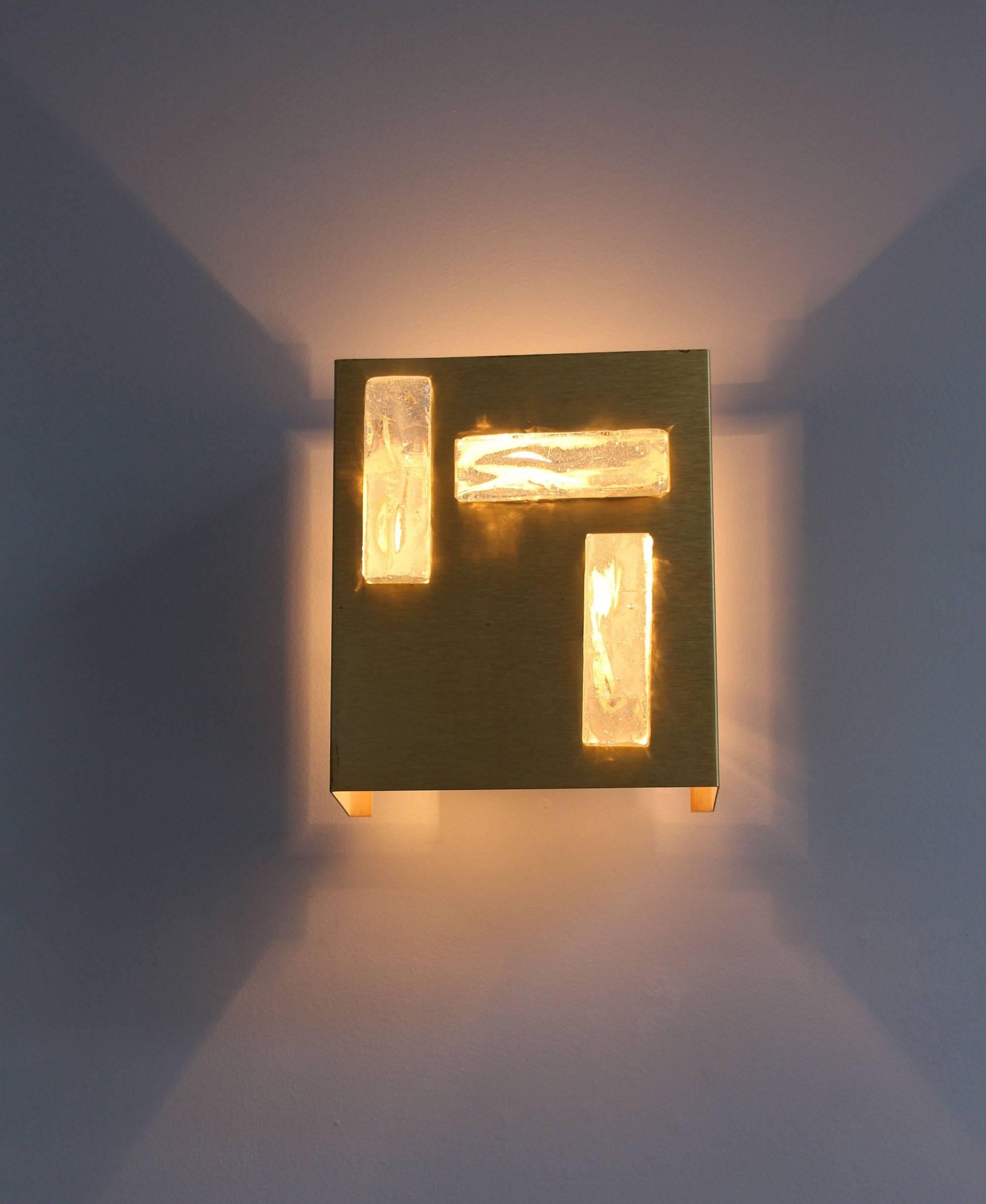 A French 1970s bronze and glass slab sconce by Perzel.