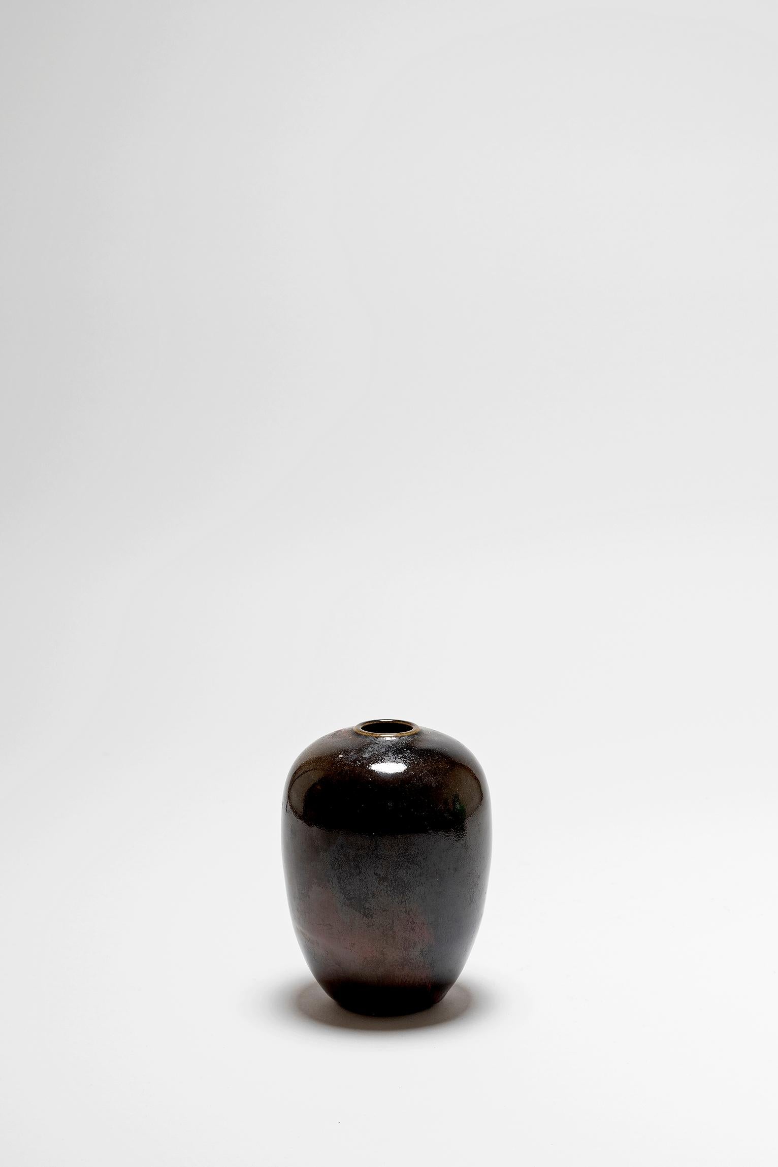 A dark olive green and brown ceramic vase, signed Djian
France, 1970s.