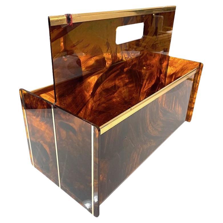 A French 1970s faux tortoiseshell and brass magazine rack by Mercier Freres For Sale