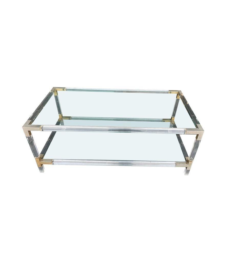 Mid-Century Modern A French 1970s lucite and brass two tiered coffee table with glass plates For Sale