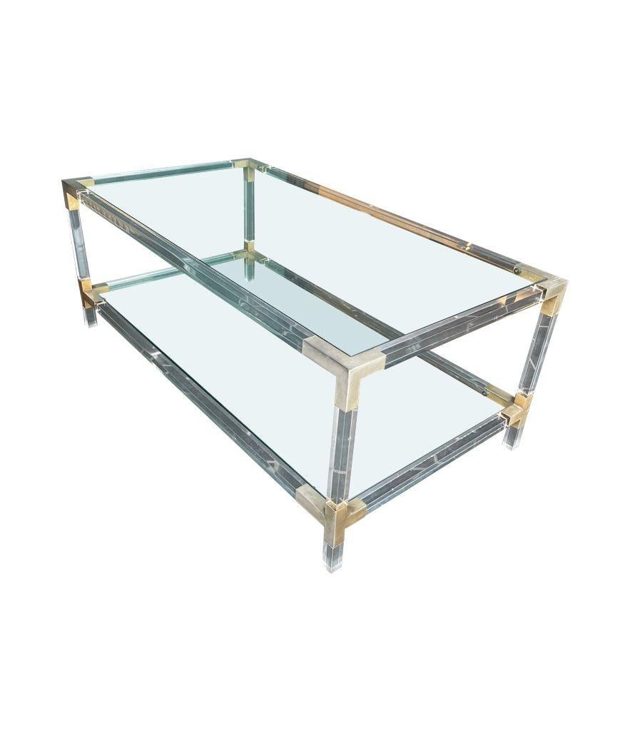 Metal A French 1970s lucite and brass two tiered coffee table with glass plates