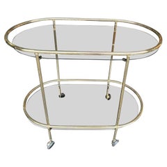 French 1970s Oval Brass and Smoked Glass Bar Trolley by Rue Royale