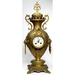 A French 19th-20th Century Gilt-Metal 3-Piece Clock and Candelabra Garniture Set