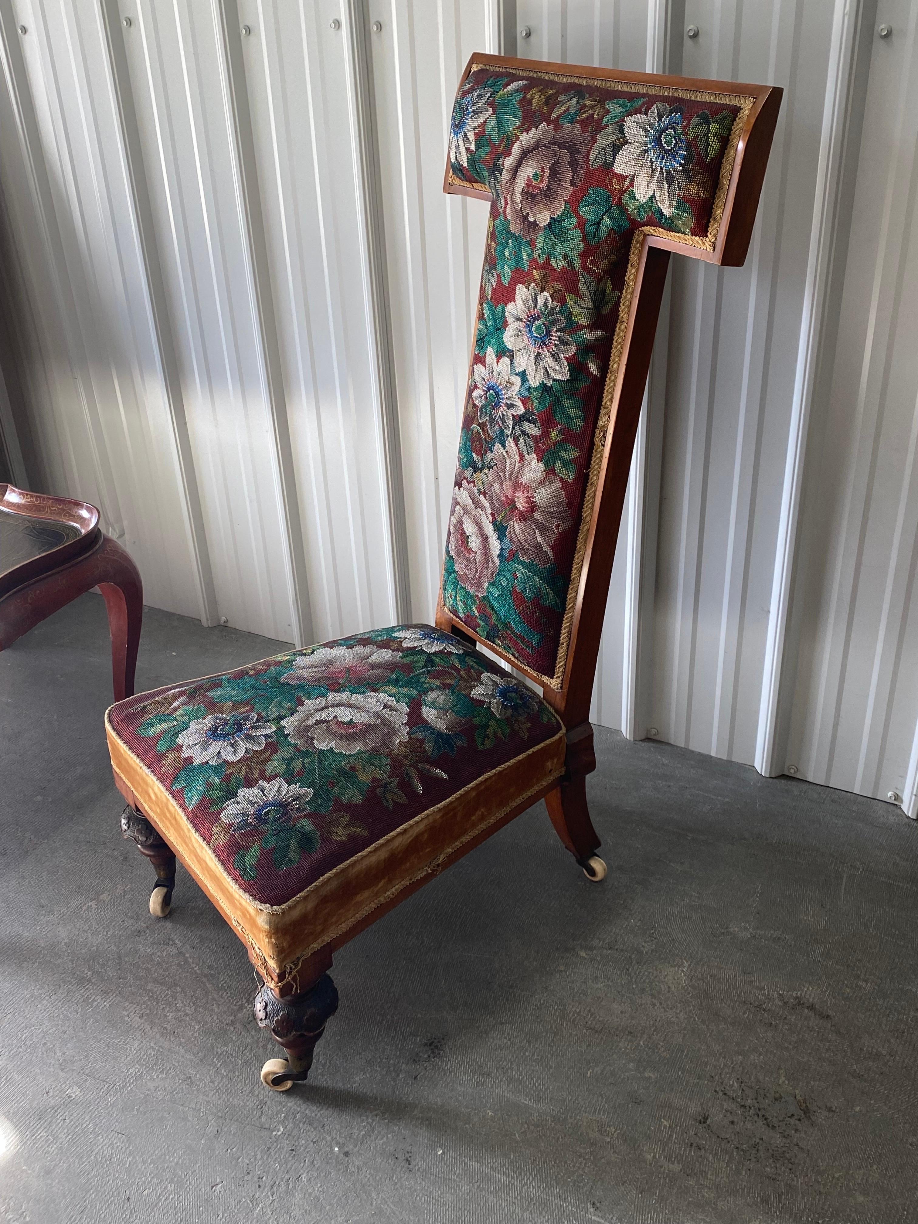 A French 19th C. Prie Dieu or Prayer Chair with Hand-Embroidered Beaded Upholstery. 
A high wooden frame back to kneel on and stablize the arms. Stunning hand-embroidered floral beaded seat and back. Contrasting caramel velvet and trim around edges