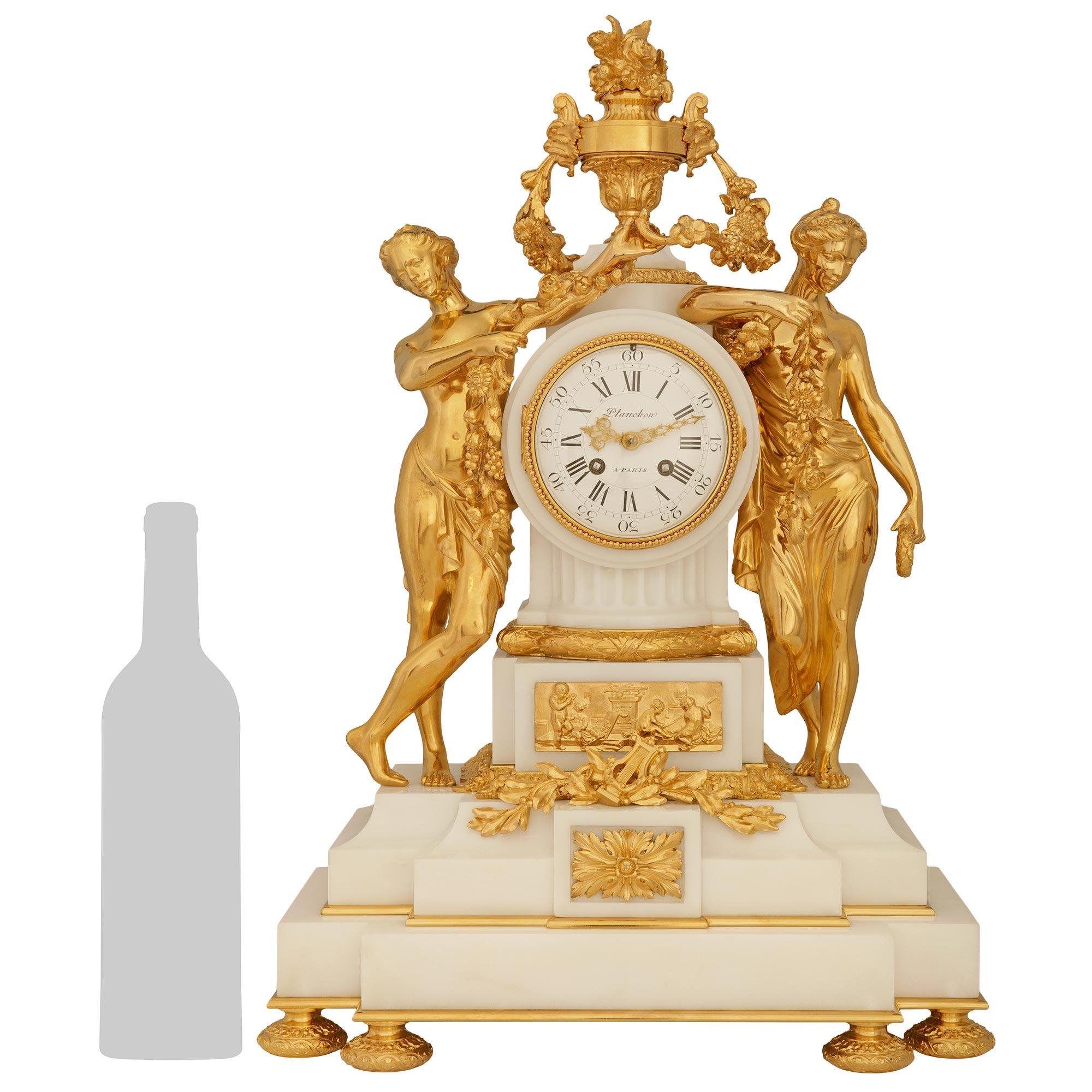 A most delightful and high quality French 19th century Louis XVI st. white Carrara marble and Ormolu clock, signed by Mathieu Planchon. This stunning clock is raised by six finely chased topie shaped Ormolu bun feet below a two step Carrara marble