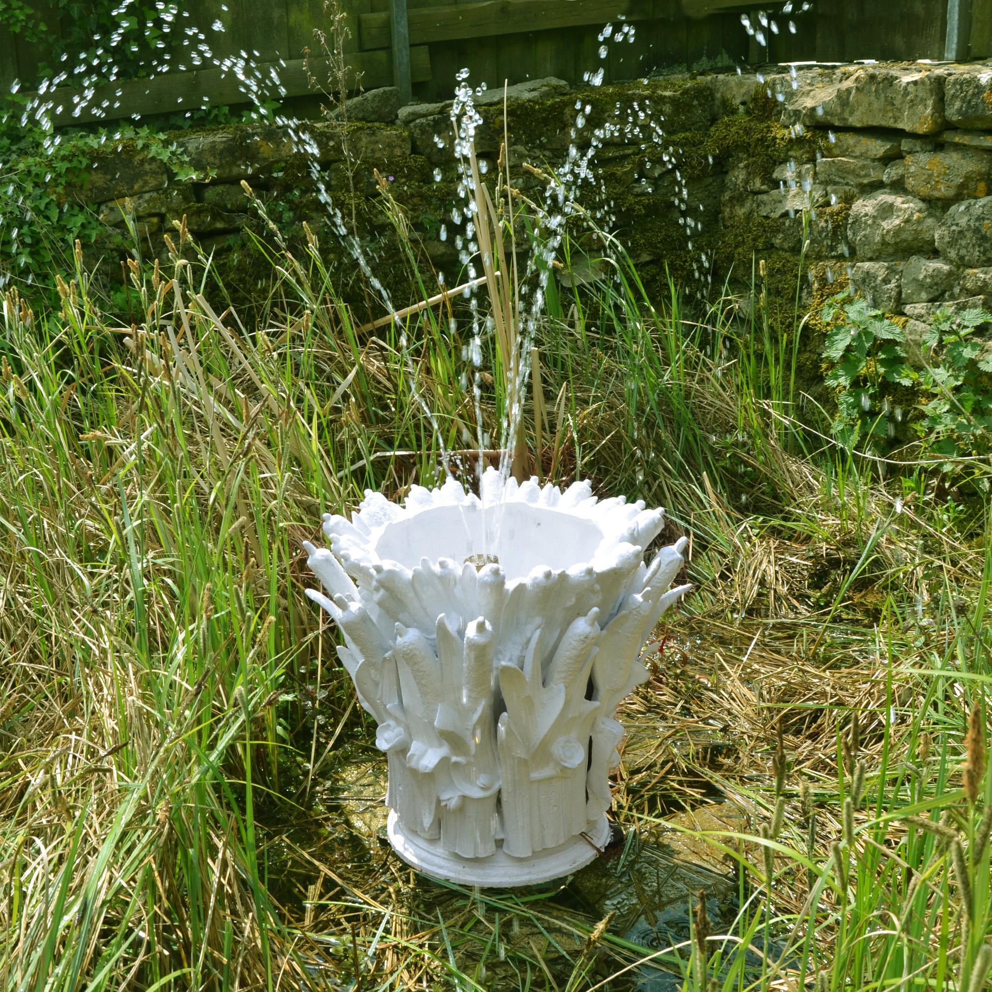 A French 19th century cast iron fountain head in the form of a collection of bulrushes. Cast by the Val d’Osne Foundry near Paris, it is made up of a number of sections then bolted together to form a fountain spout housing. 

We have shot-blasted,
