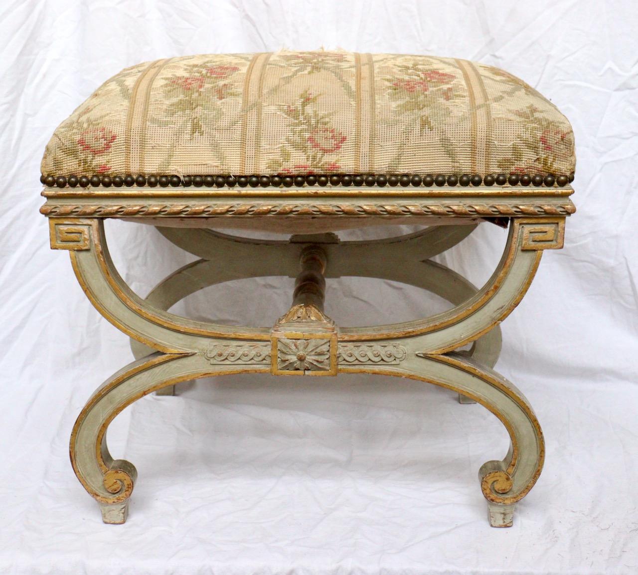 A French 19th century curule stool
Gilt and lacquered wood
Louis XVI Style
Napoléon III Period
circa 1880
Damaged petit point tapestry upholstery.
 