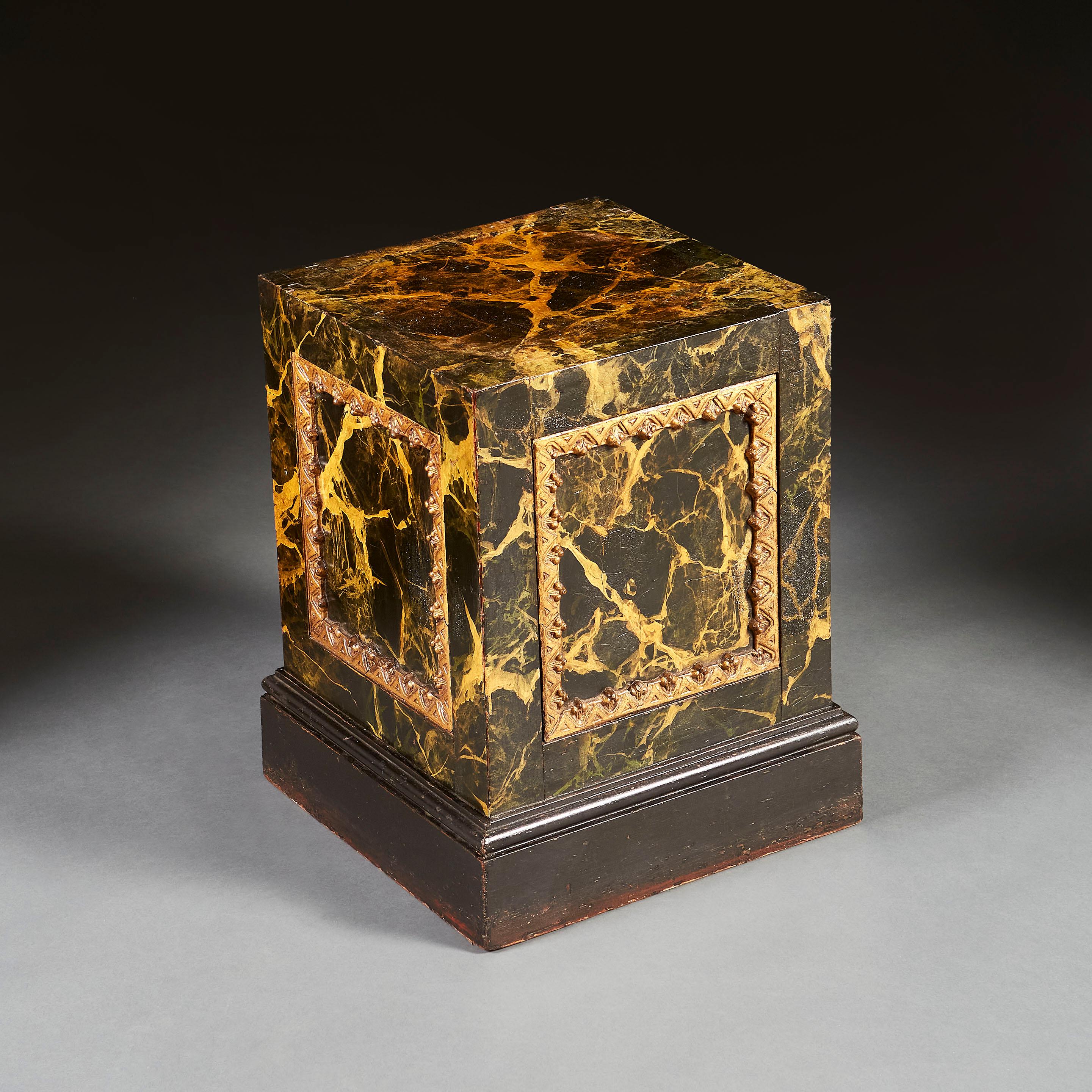 A mid nineteenth century painted plinth with faux marble decoration, with carved and gilt borders to the insets on three of the four sides, supported on a square ebonised base.