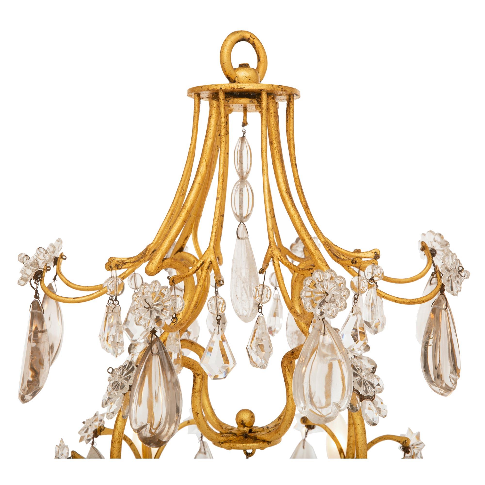 Louis XV A French 19th century Gilt Iron, crystal and rock crystal chandelier For Sale
